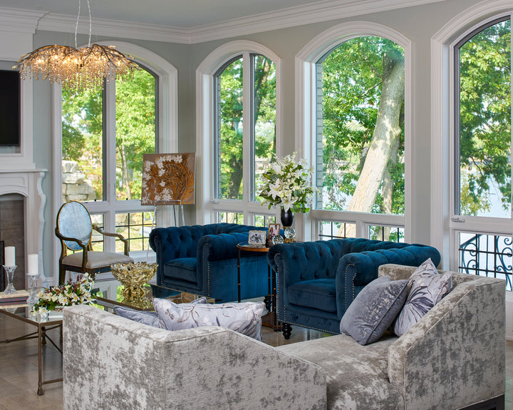 Reem Akkad Design Rochester Michigan Detroit Beautiful Living room with arch windows and dark blue velvet chairs